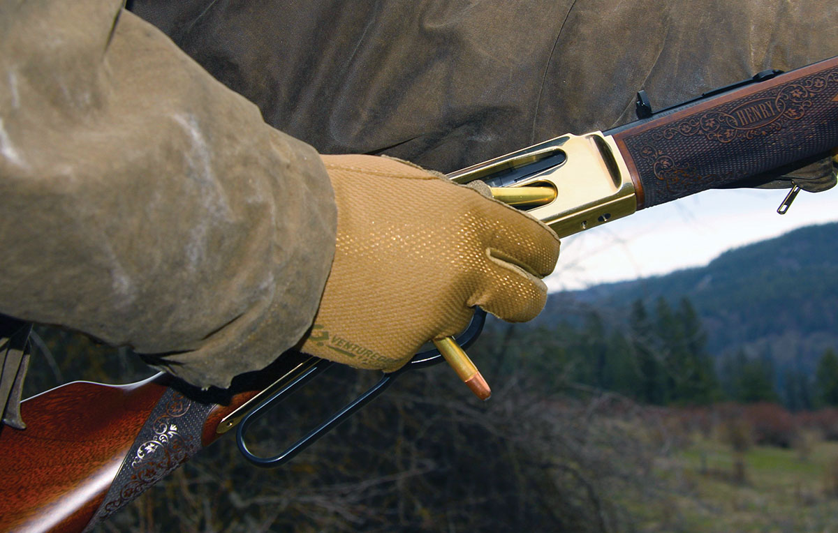 Loading through the side gate of the Henry rifle is faster and easier than dropping rounds in the tube slot and reengaging the follower, and allows topping off the tubular magazine on the fly.